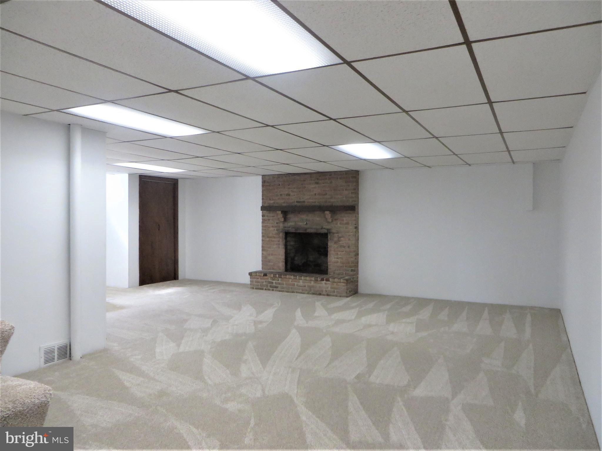 304 West Brubaker Valley Road Lititz, PA 17543 - Photo 10 of 31 26' Wide Finished Lower Level w/ Msnry Fireplace