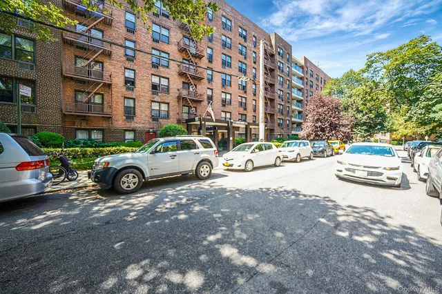 a view of a cars parked in front of a building