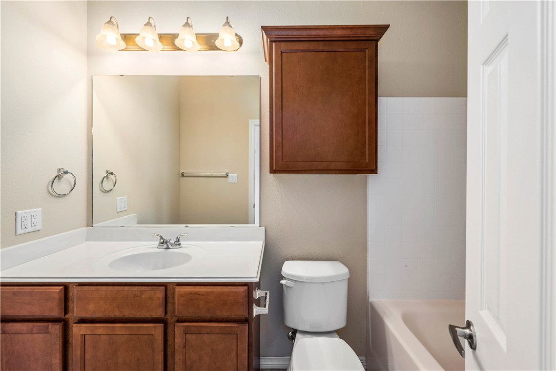 1198 Jones-Butler Road, Unit 1809 College Station, TX 77840 - Photo 9 of 14 a bathroom with a sink toilet and mirror