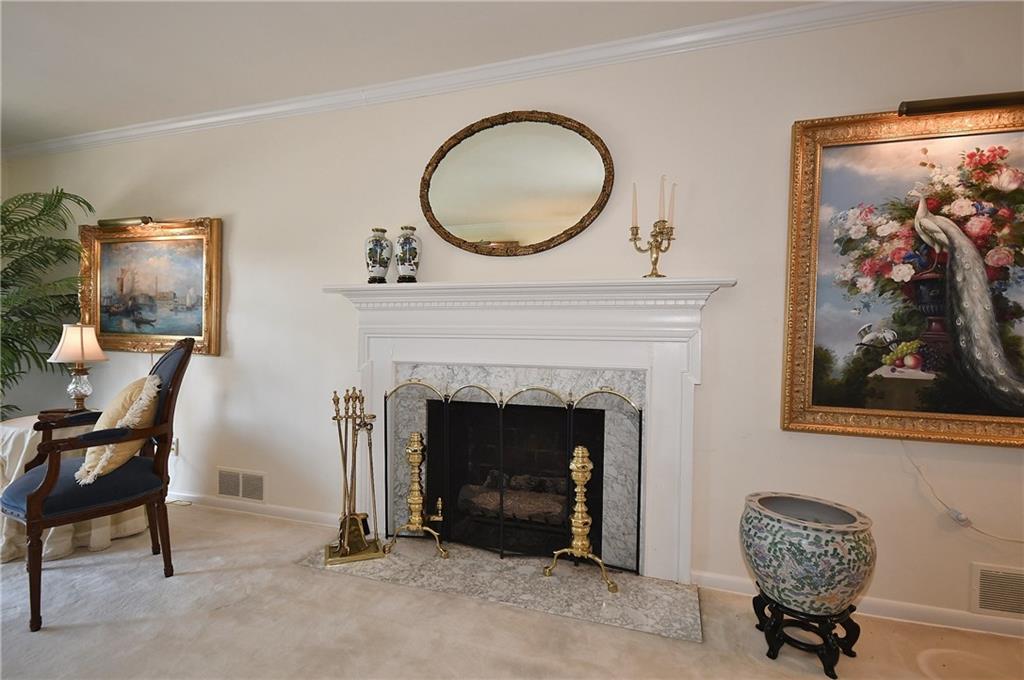 765 Pinoak Road Pittsburgh, PA 15243 - Photo 7 of 23 Living room with white wool carpet and gas fireplace