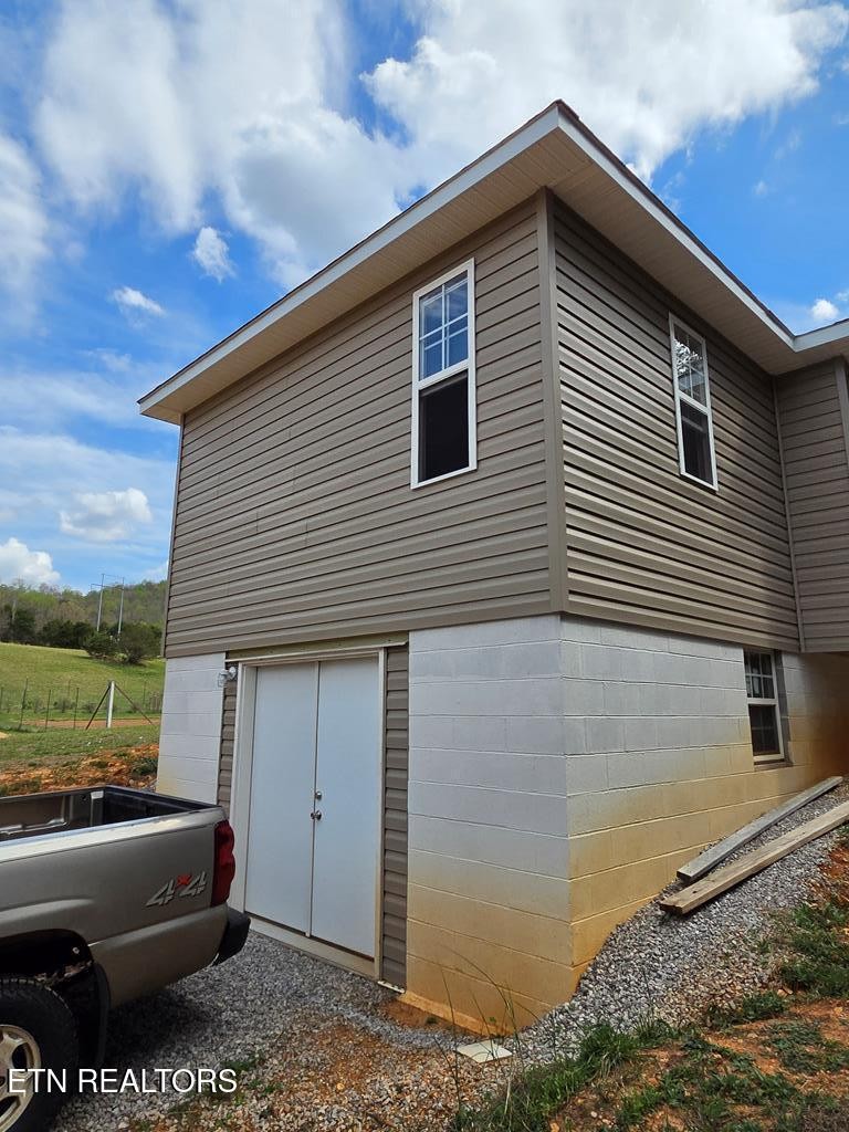 1518 Cummingsville And Sparkman Road Doyle, TN 38559 - Photo 57 of 58 a front view of a house with garden
