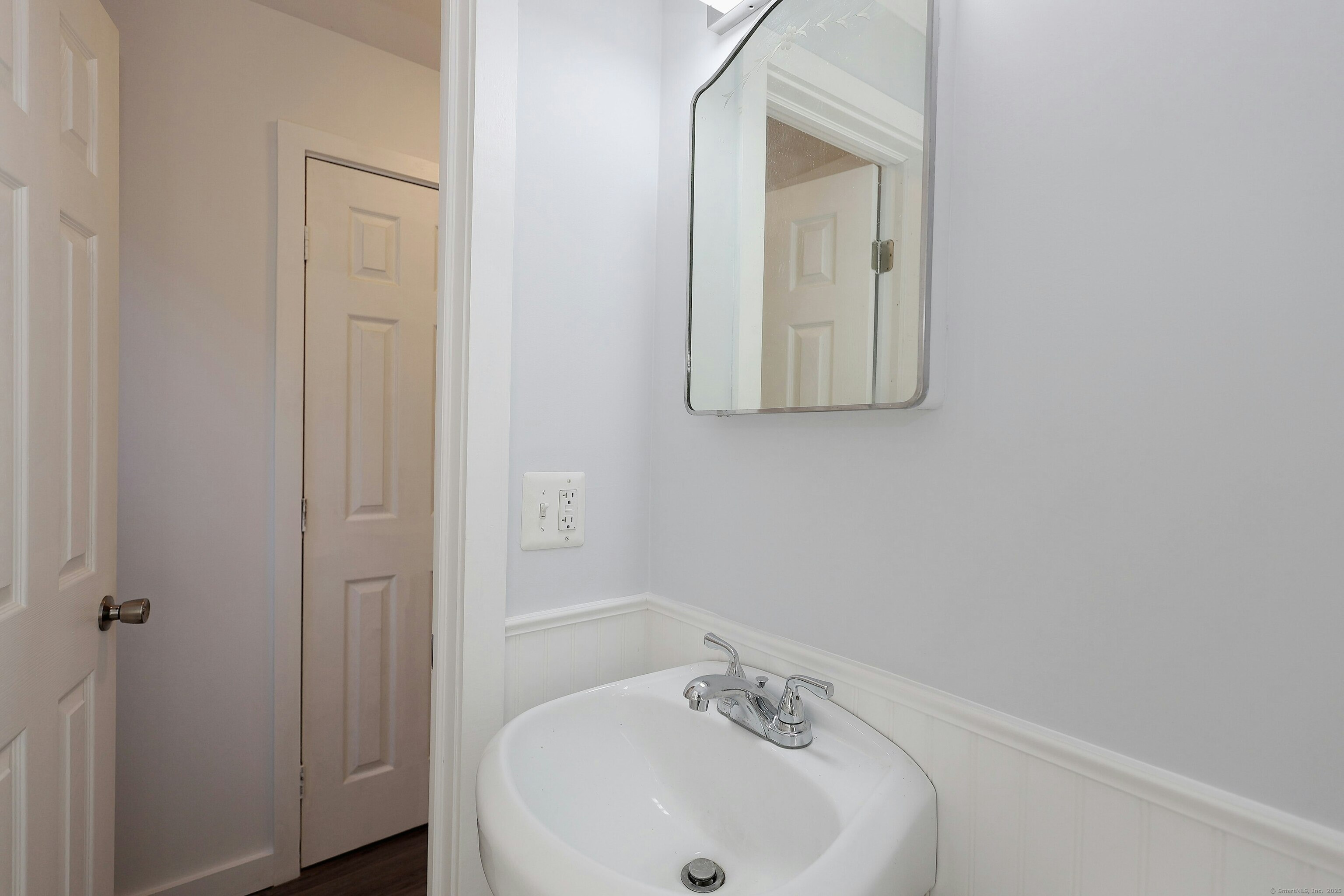 213 Mamanasco Road Ridgefield, CT 06877 - Photo 13 of 35 a bathroom with a sink and mirror