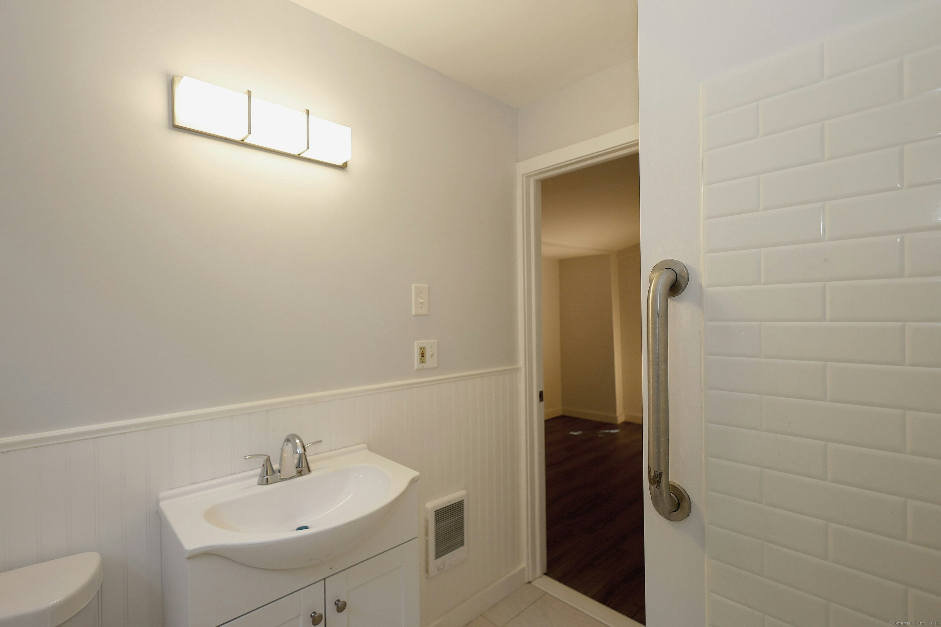 213 Mamanasco Road Ridgefield, CT 06877 - Photo 15 of 35 a bathroom with a sink a toilet and shower