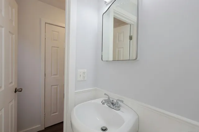 a bathroom with a sink and mirror