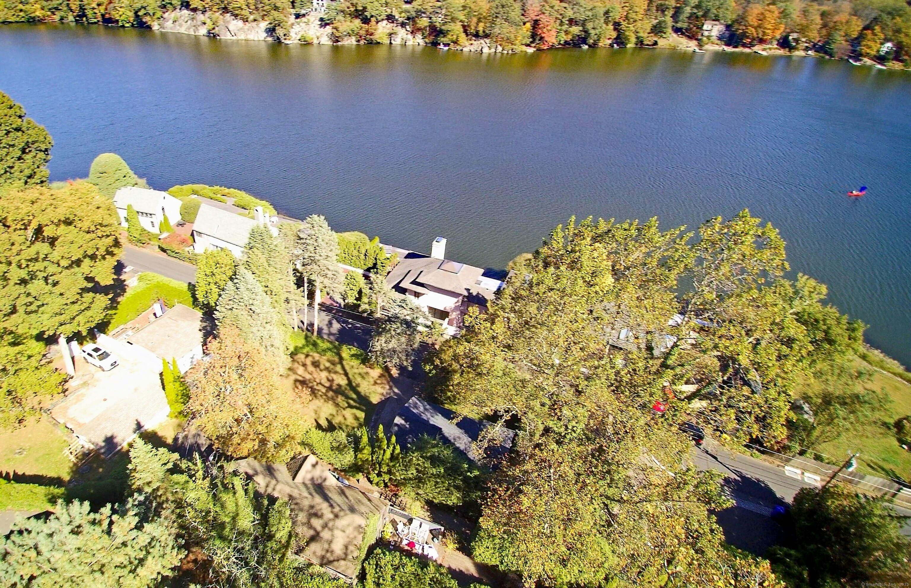 213 Mamanasco Road Ridgefield, CT 06877 - Photo 35 of 35 a blue swimming pool with a lake view