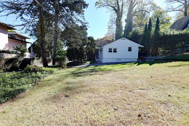 a house with trees in the background