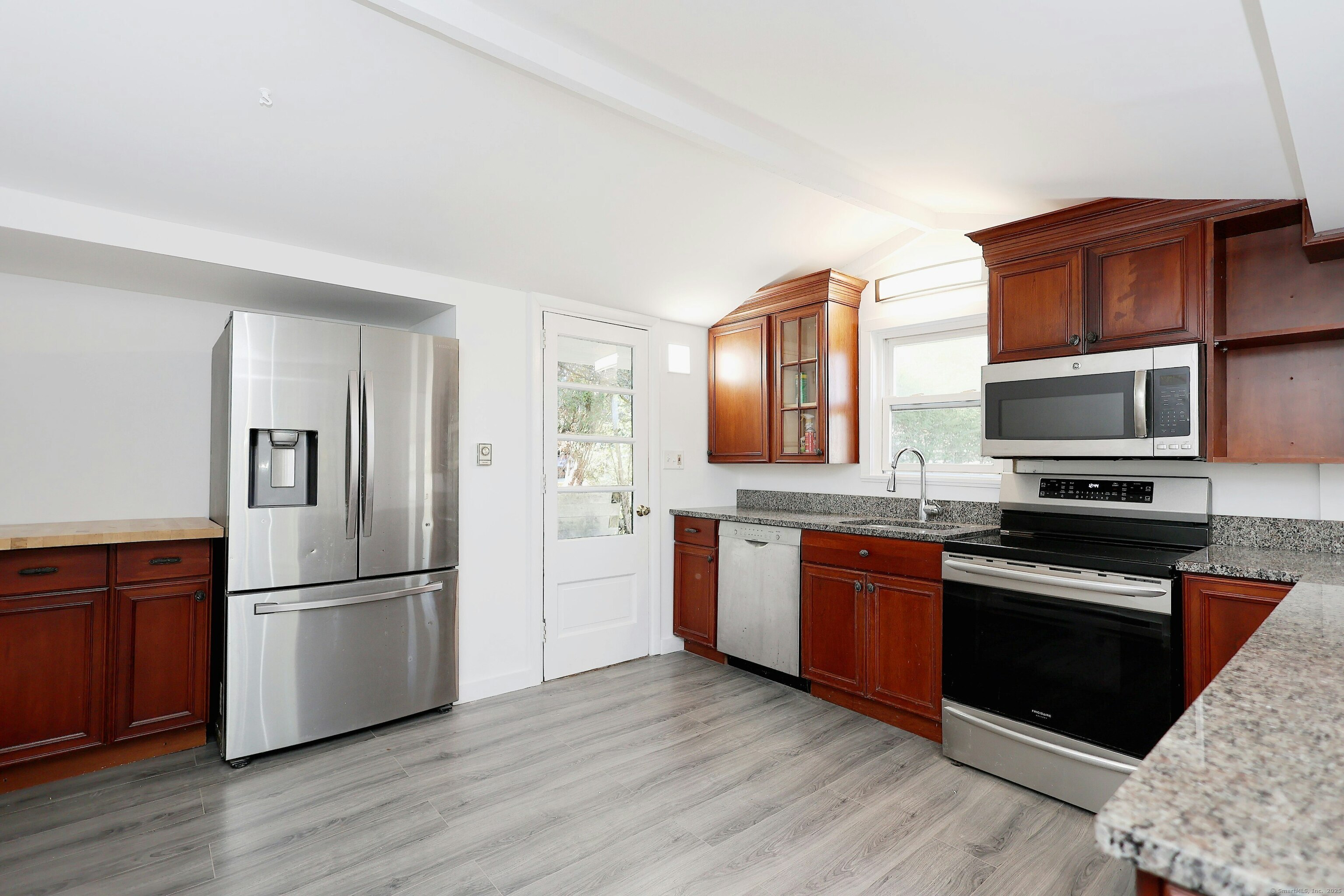 213 Mamanasco Road Ridgefield, CT 06877 - Photo 8 of 35 a kitchen with stainless steel appliances granite countertop a refrigerator stove and sink