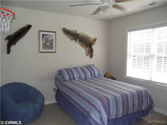 15275 Teman Mill Road Beaverdam, VA 23015 - Photo 11 of 12 a bedroom with a bed and a couch