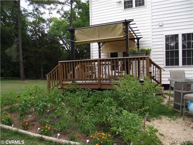 15275 Teman Mill Road Beaverdam, VA 23015 - Photo 12 of 12 a view of a house with backyard and a garden