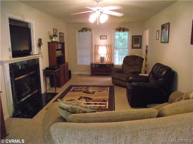 15275 Teman Mill Road Beaverdam, VA 23015 - Photo 8 of 12 a living room with furniture and a flat screen tv