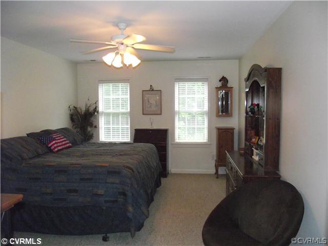 15275 Teman Mill Road Beaverdam, VA 23015 - Photo 9 of 12 a bedroom with a bed furniture and a window