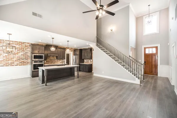 a view of an entryway with wooden floor
