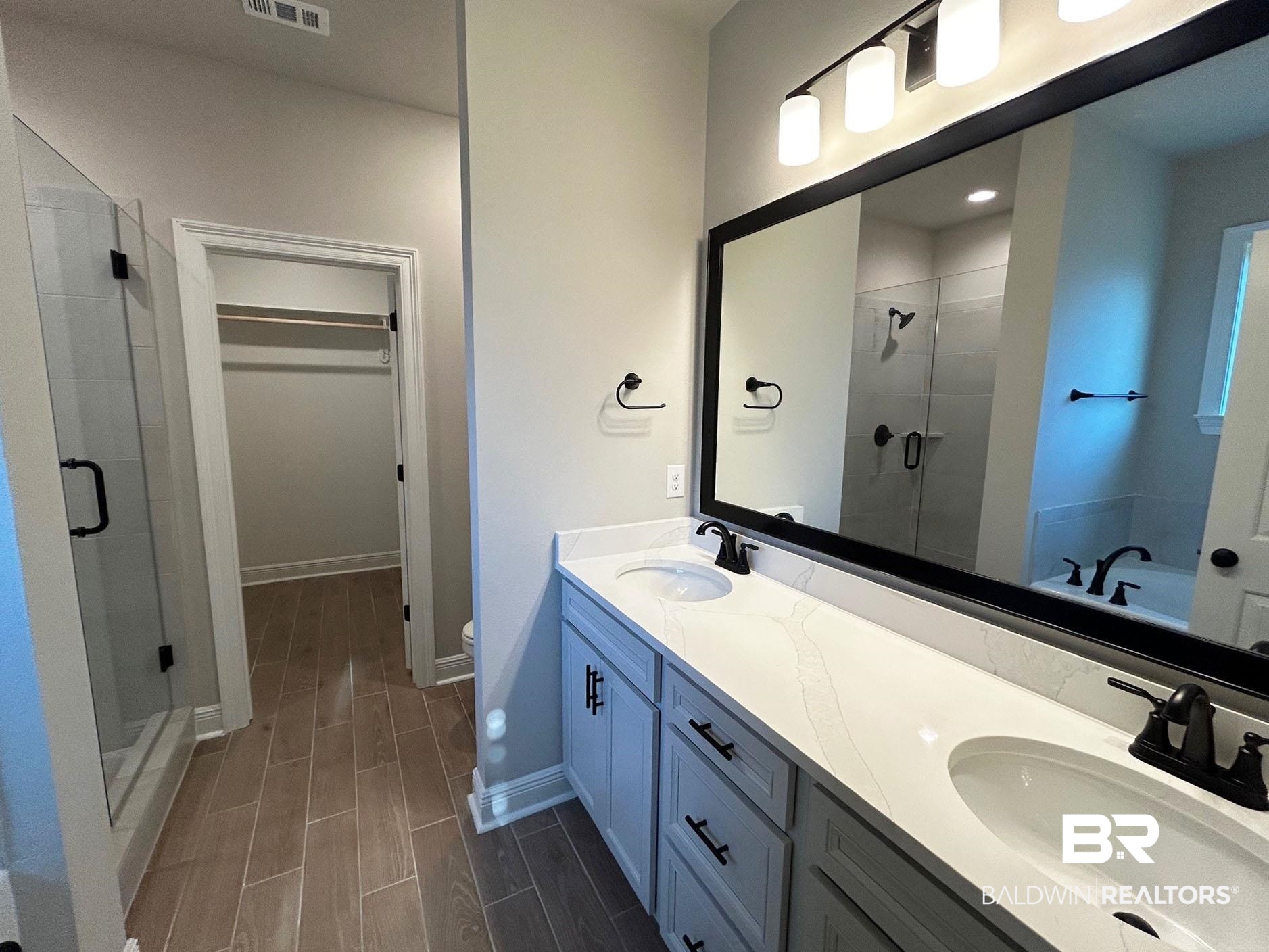 813 Sumter Loop Foley, AL 36535 - Photo 9 of 18 Full bathroom featuring separate shower and tub, vanity, and toilet