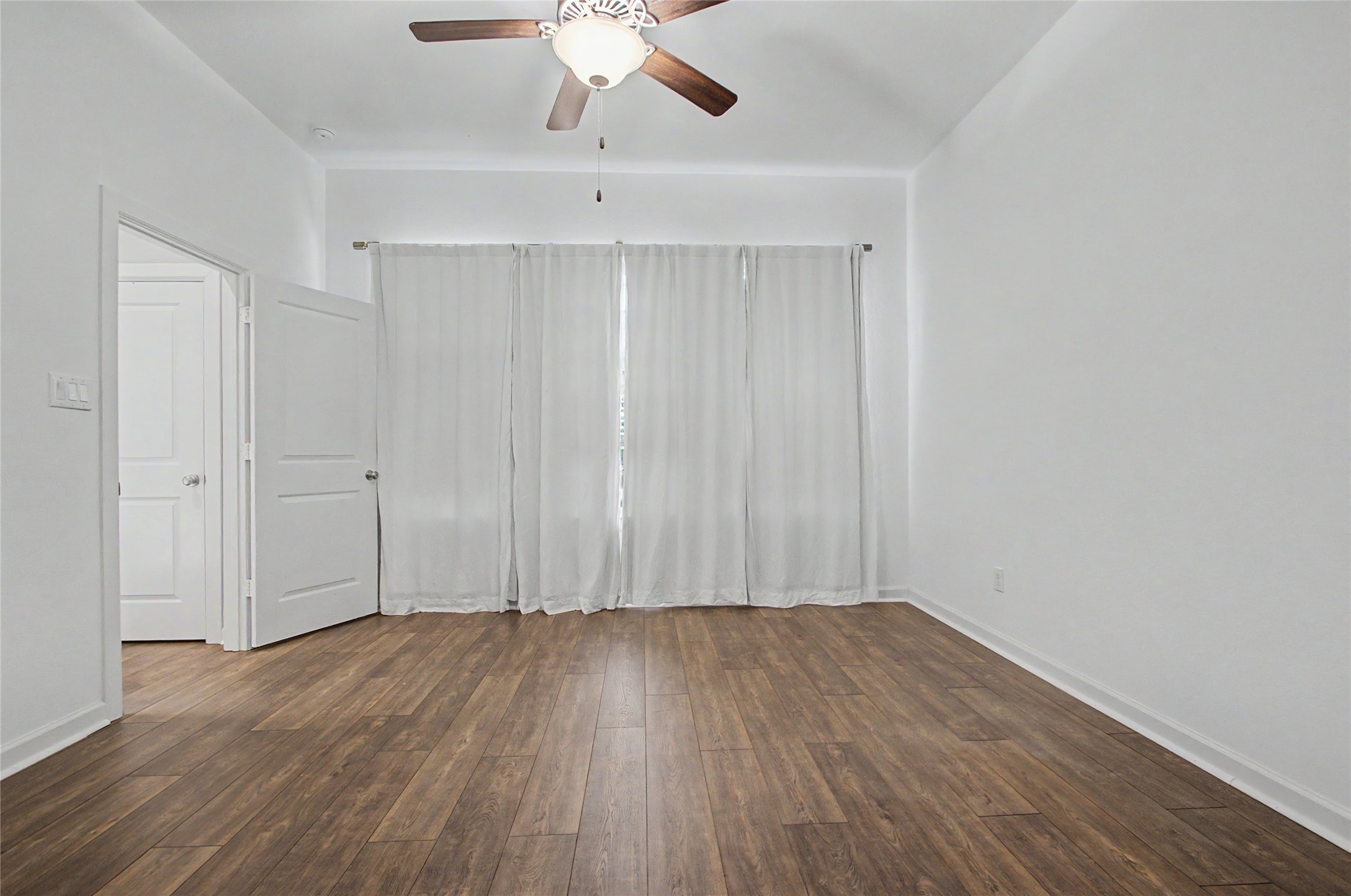 19718 Shinnery Ridge Court Cypress, TX 77433 - Photo 9 of 23 a view of room with hardwood floor and fan