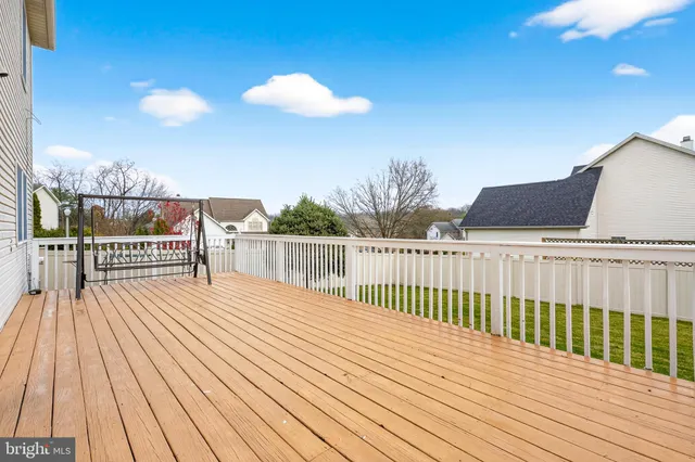 a view of balcony with wooden floor