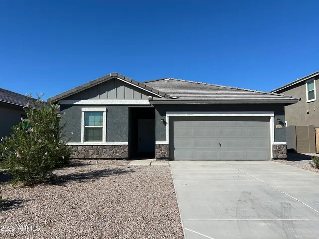 a front view of a house with a garage