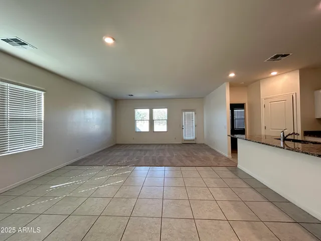 a view of an empty room and a window