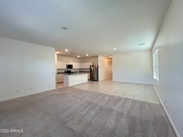 a view of a kitchen with a sink and cabinets