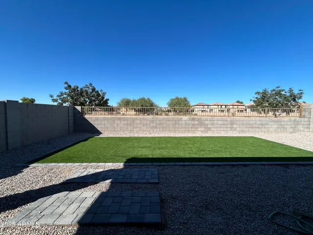 a view of a back yard of the house