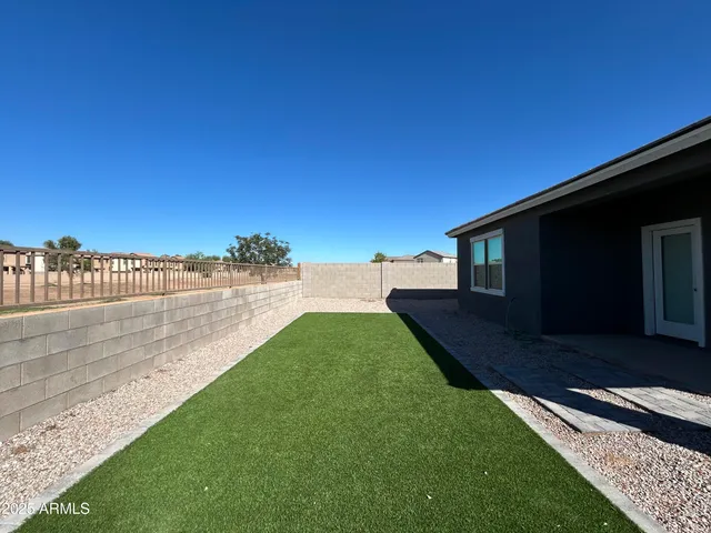 a view of a lake with houses in the back
