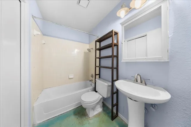 a view of a pathway with a wrought fence