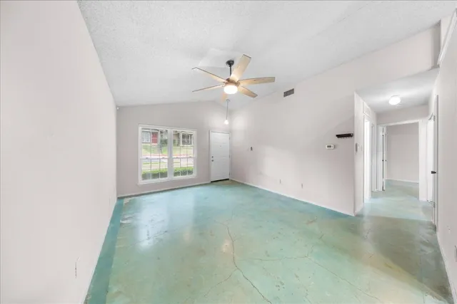a kitchen with a refrigerator a sink and cabinets