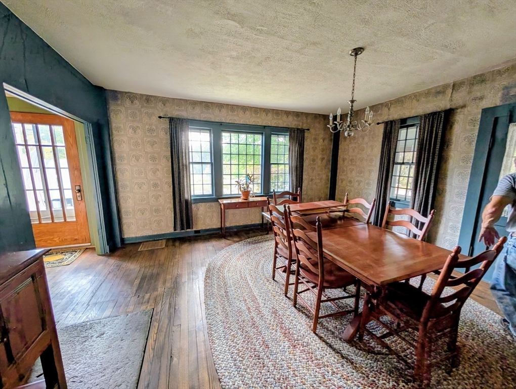 216 Brookfield Road Charlton, MA 01507 - Photo 32 of 42 a view of a dining room with furniture window and wooden floor