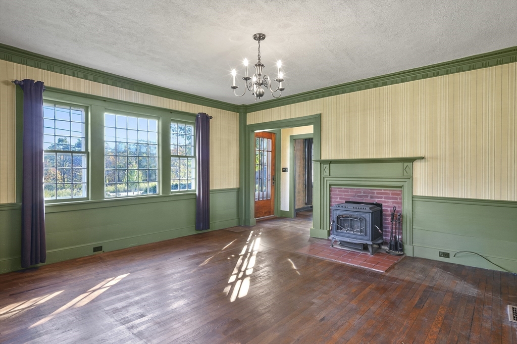 216 Brookfield Road Charlton, MA 01507 - Photo 5 of 42 a living room with furniture and a fireplace
