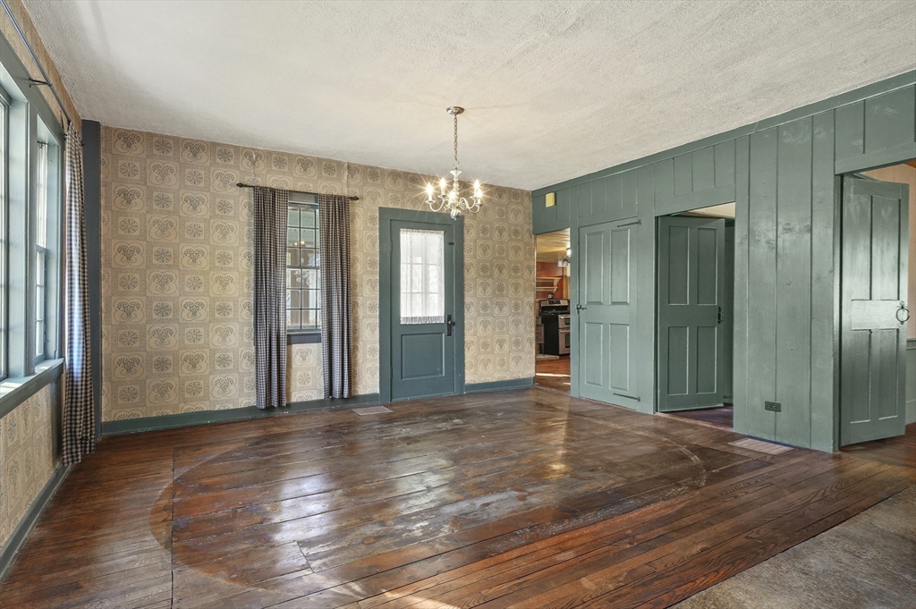 216 Brookfield Road Charlton, MA 01507 - Photo 6 of 42 a view of a room with window and wooden floor
