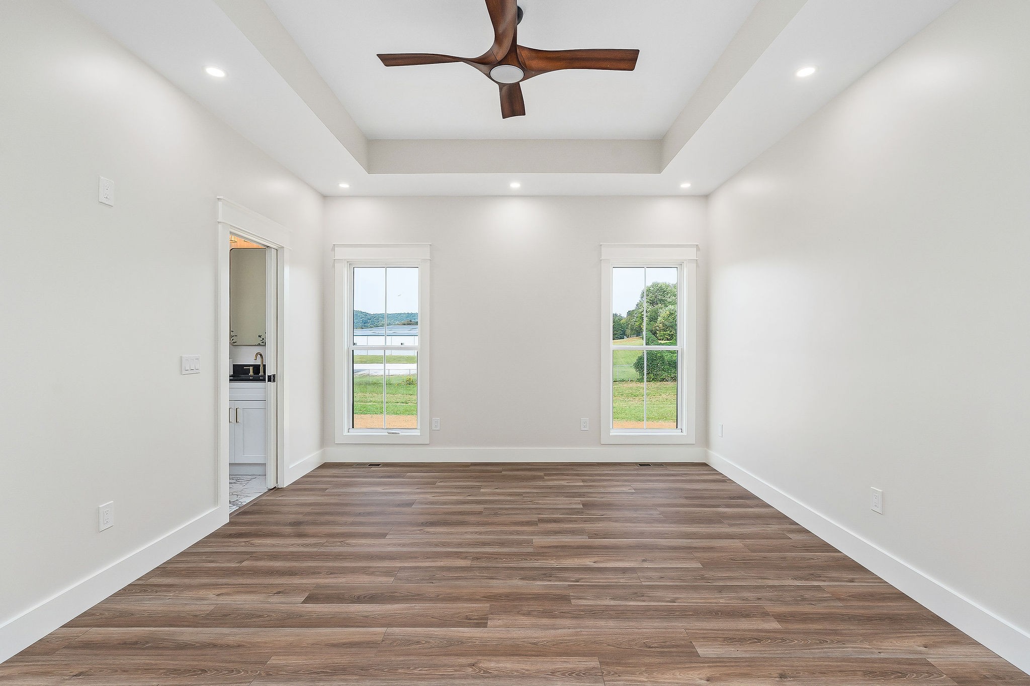 217 Oaklawn Cemetery Road Sparta, TN 38583 - Photo 22 of 42 a view of an empty room with wooden floor and a window