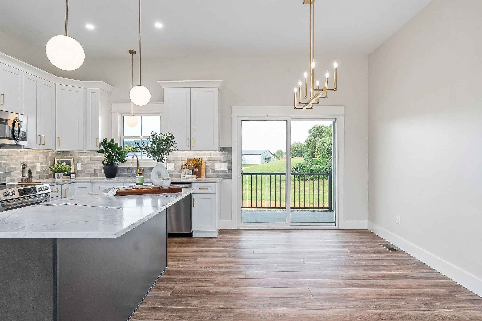 217 Oaklawn Cemetery Road Sparta, TN 38583 - Photo 8 of 42 a kitchen with kitchen island granite countertop a stove a sink and a wooden floors
