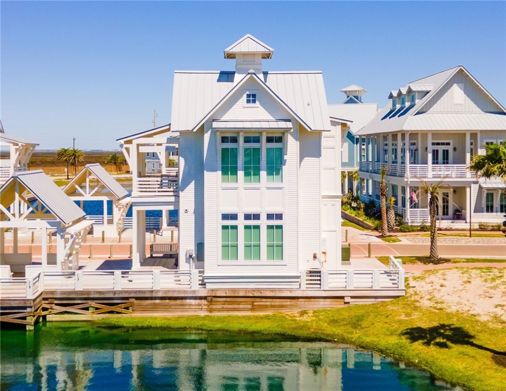 551 South Shore Drive Port Aransas, TX 78373 - Photo 1 of 38 a view of a building with a swimming pool