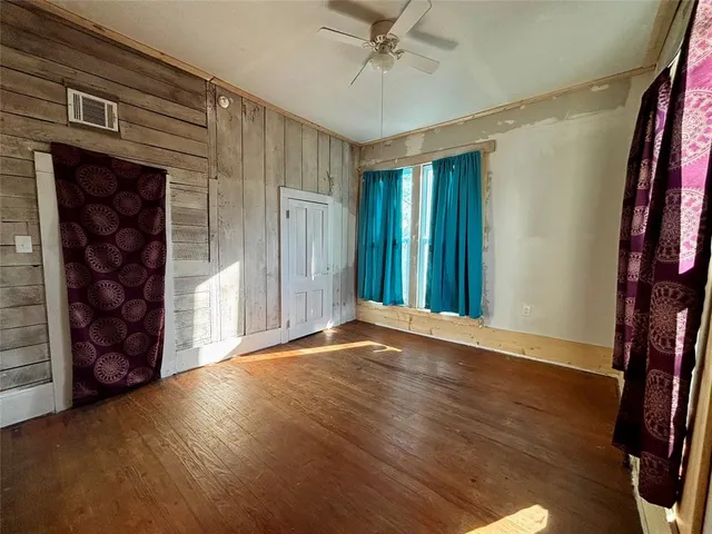 wooden floor and window in an empty room