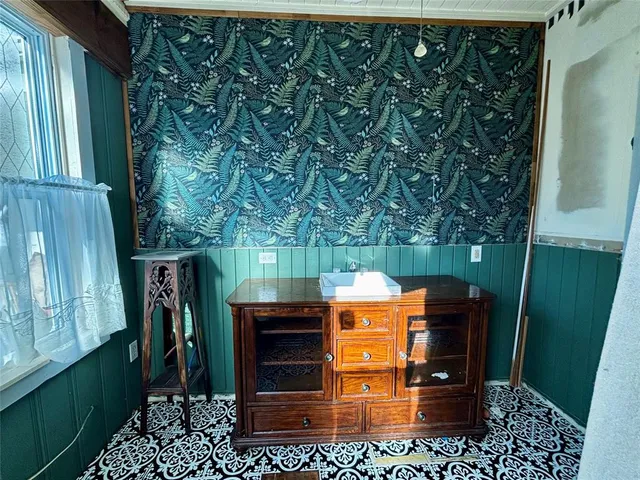 a bathroom with a double vanity sink mirror and toilet