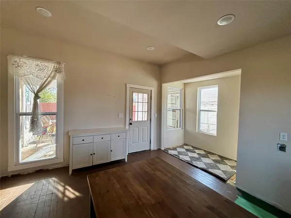 a living room with furniture and windows