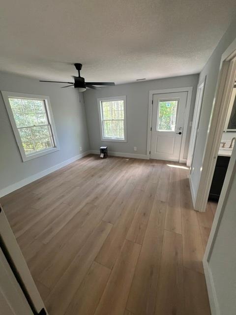1616 Abe Cove Road Hiawassee, GA 30546 - Photo 11 of 17 an empty room with wooden floor and windows