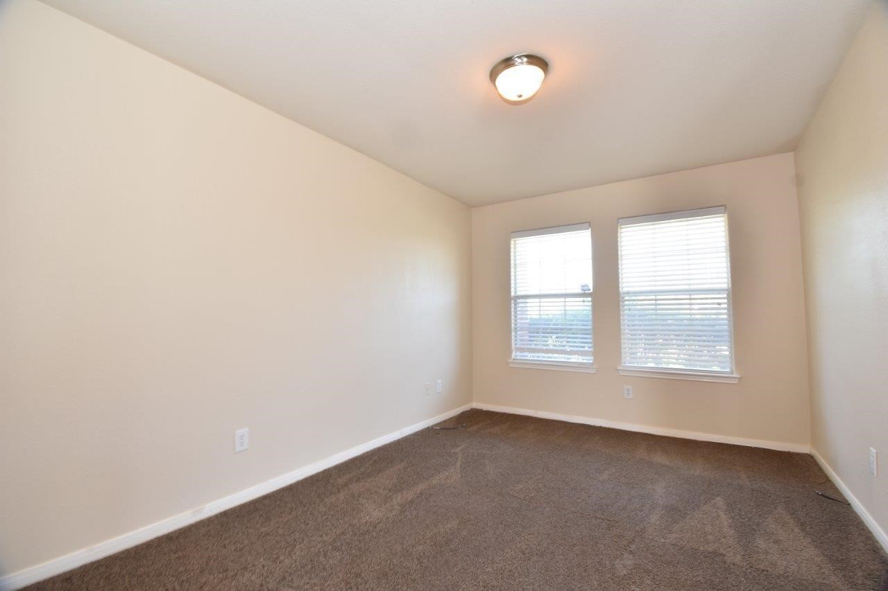 1126 Desert Oasis Lane Rosenberg, TX 77471 - Photo 5 of 16 an empty room with a window