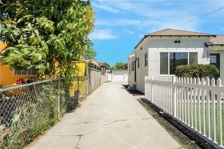 a view of a house with a small yard