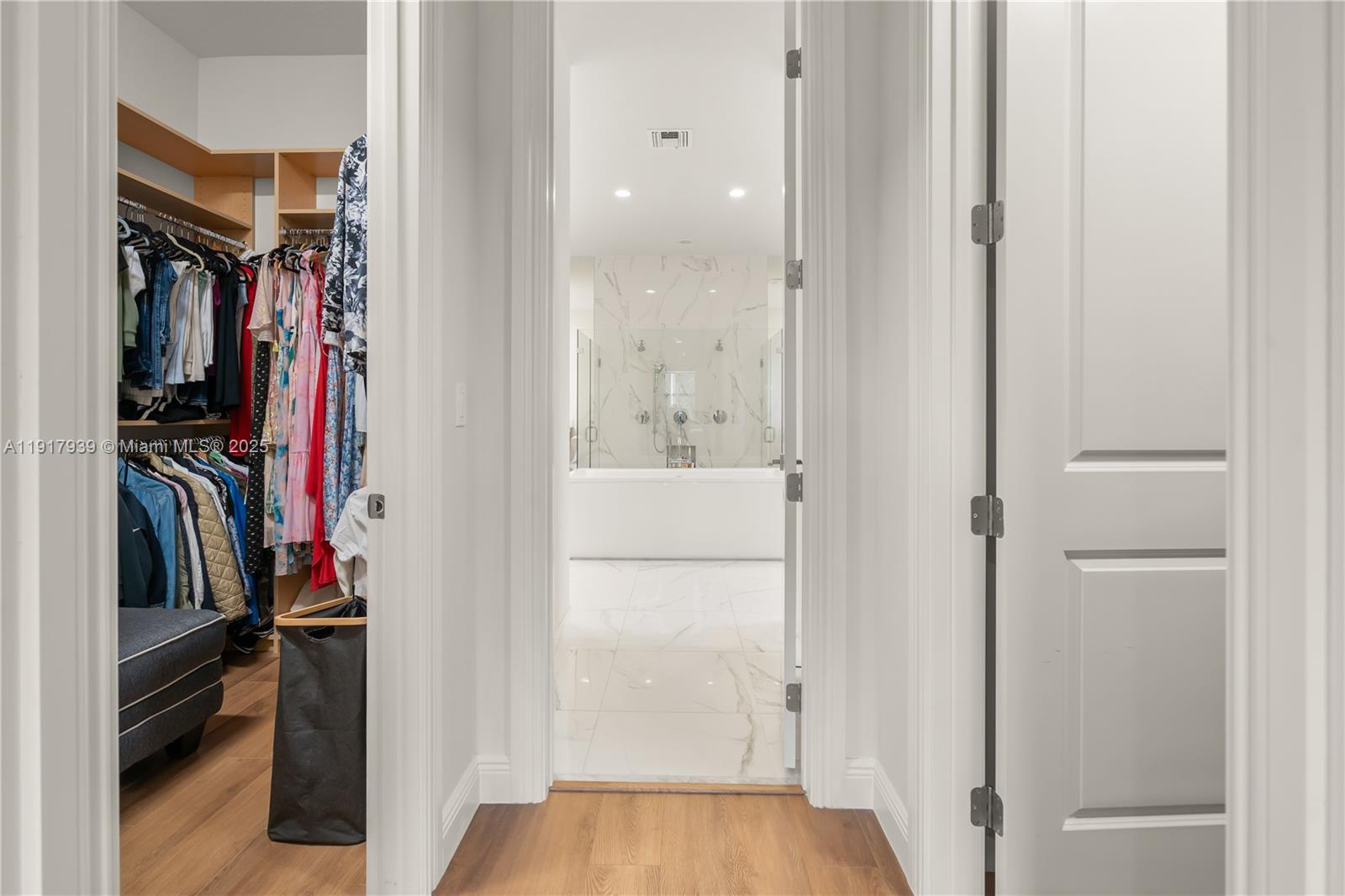 14820 Millstone Ranches Drive Davie, FL 33331 - Photo 17 of 60 a view of walk in closet with clothes and shoes