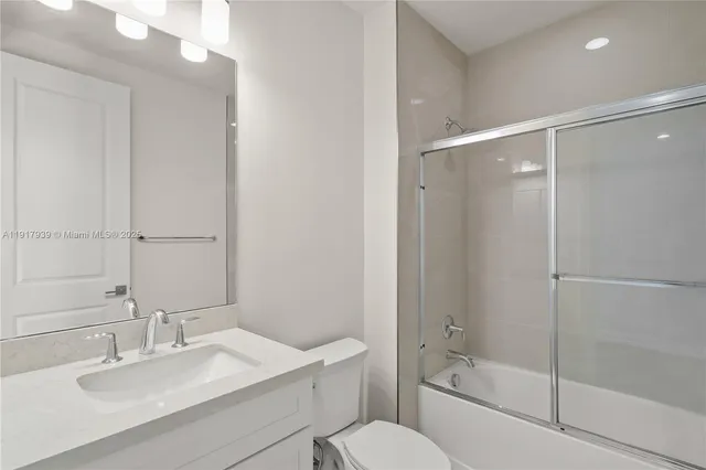 a bedroom with a bed and a chair in it