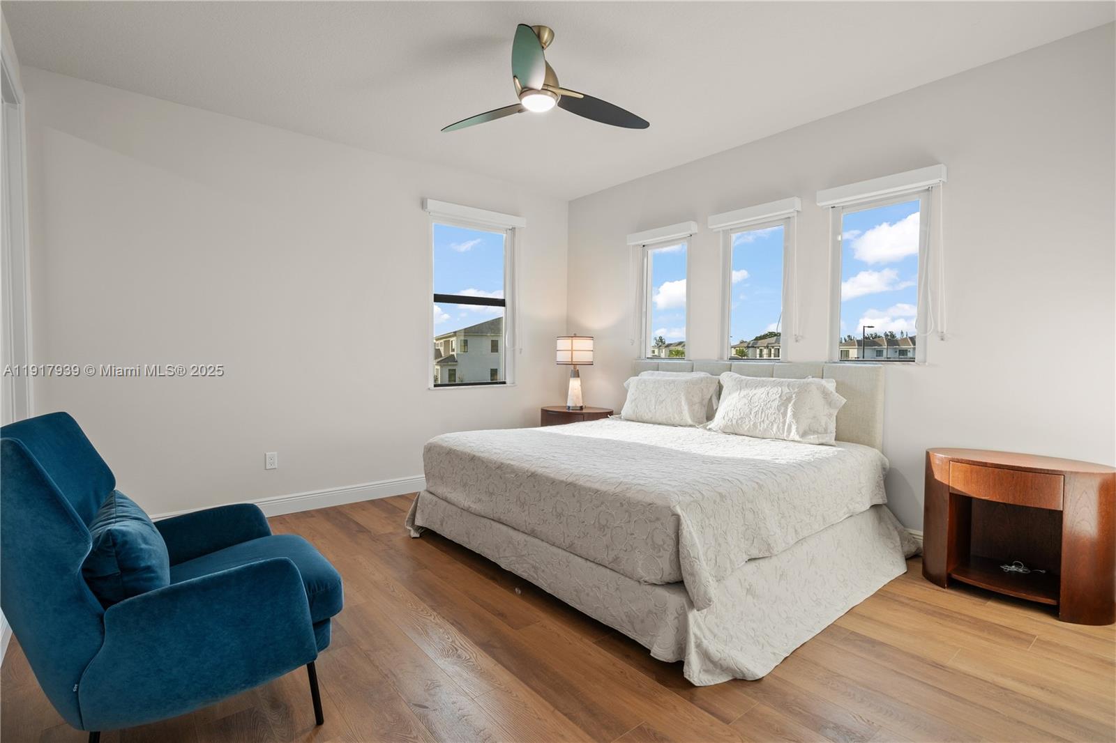 14820 Millstone Ranches Drive Davie, FL 33331 - Photo 25 of 60 a bedroom with a bed couch and a chandelier