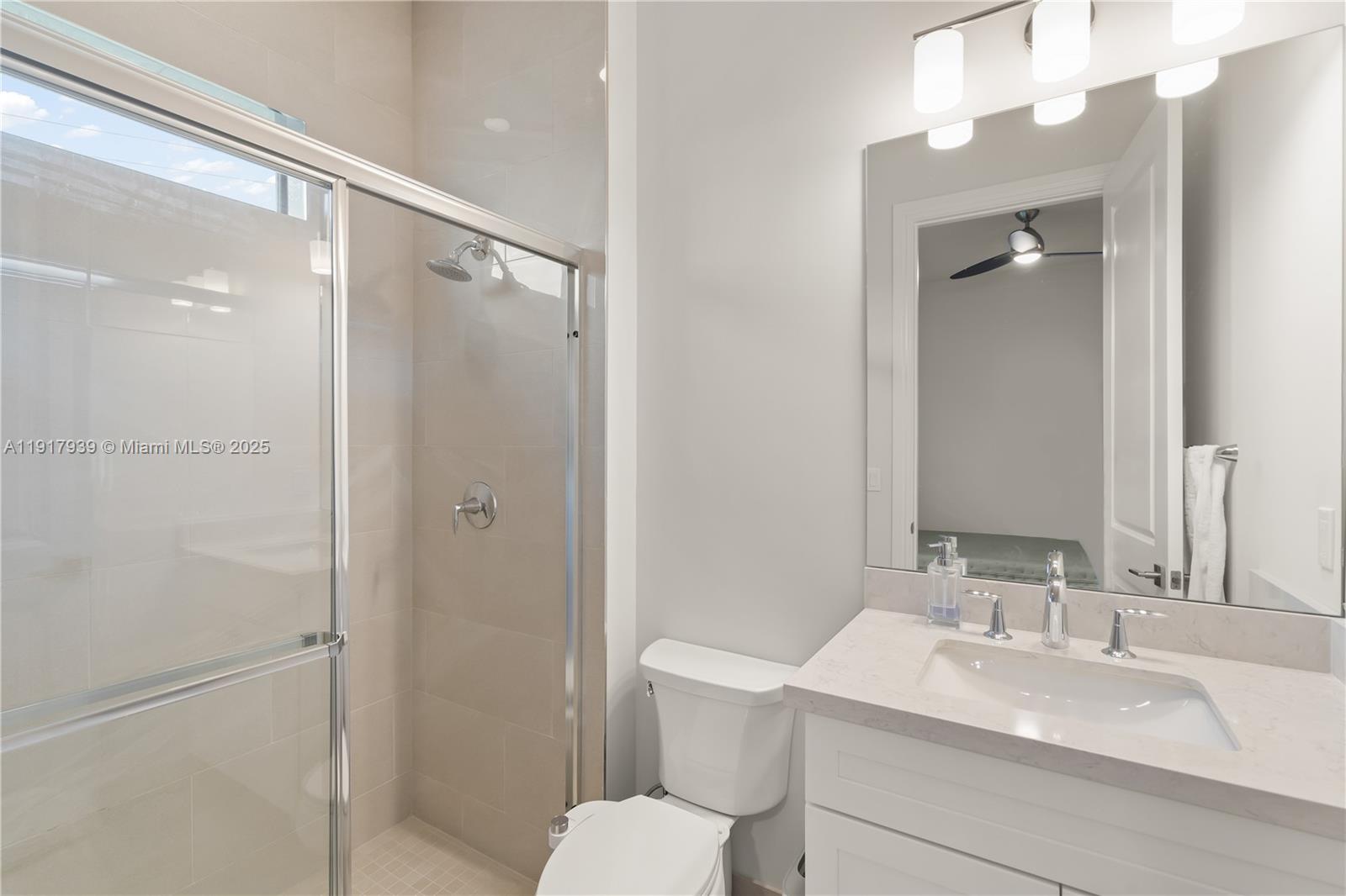 14820 Millstone Ranches Drive Davie, FL 33331 - Photo 27 of 60 a bathroom with a sink toilet vanity and shower