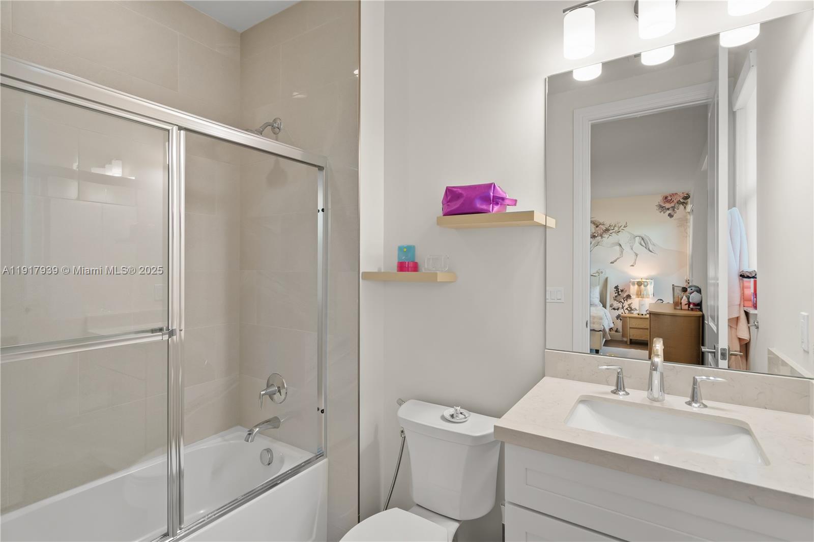 14820 Millstone Ranches Drive Davie, FL 33331 - Photo 31 of 60 a bathroom with a sink vanity mirror and toilet