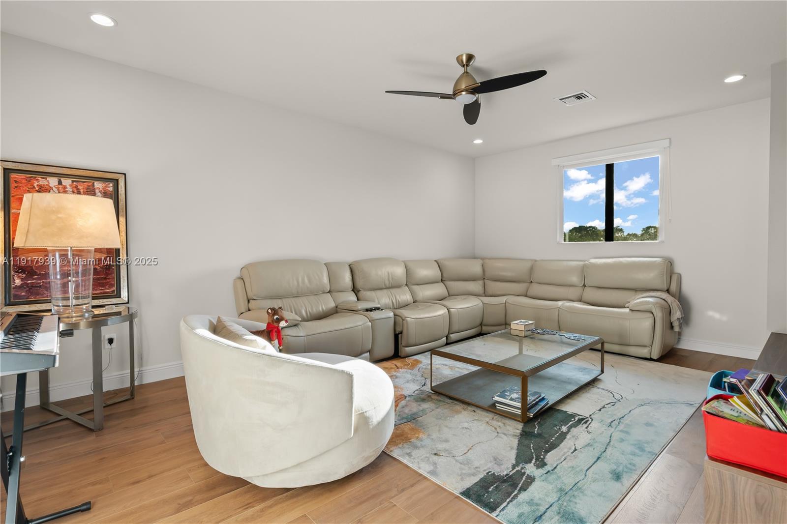 14820 Millstone Ranches Drive Davie, FL 33331 - Photo 35 of 60 a living room with furniture and a wooden floor
