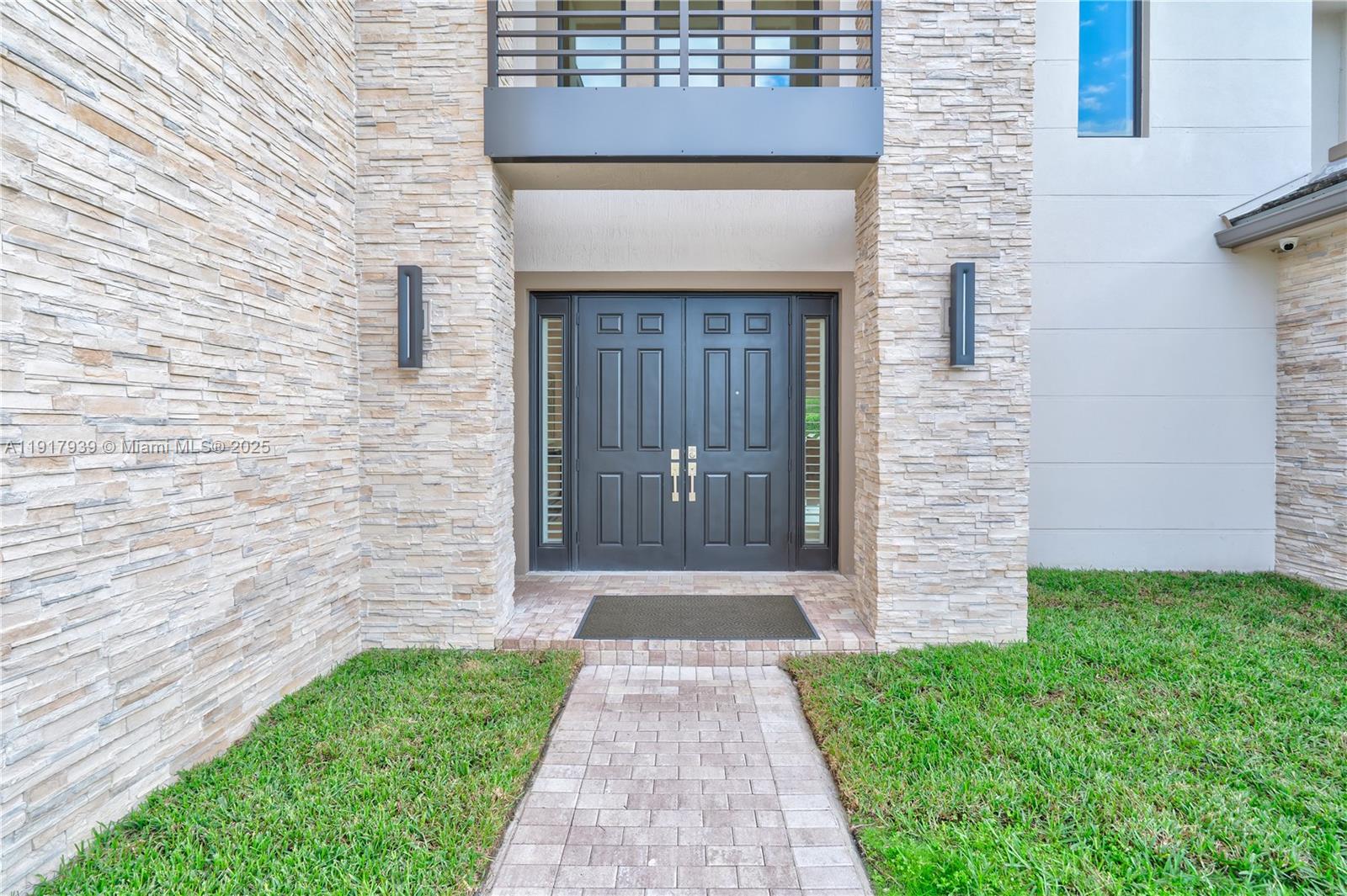 14820 Millstone Ranches Drive Davie, FL 33331 - Photo 4 of 60 a front view of a house with a yard
