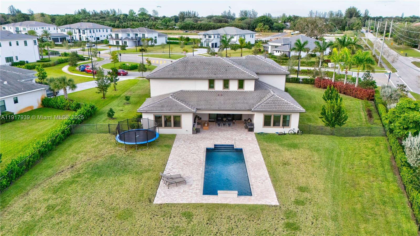14820 Millstone Ranches Drive Davie, FL 33331 - Photo 43 of 60 an aerial view of a house with swimming pool garden and outdoor seating