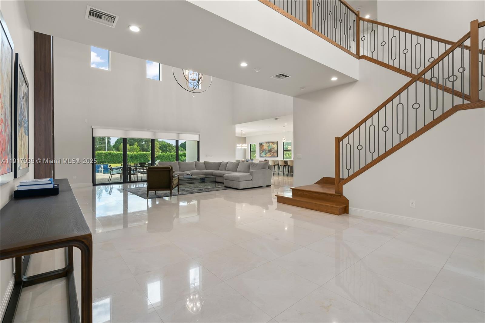 14820 Millstone Ranches Drive Davie, FL 33331 - Photo 5 of 60 a view of a livingroom with furniture and a floor to ceiling window