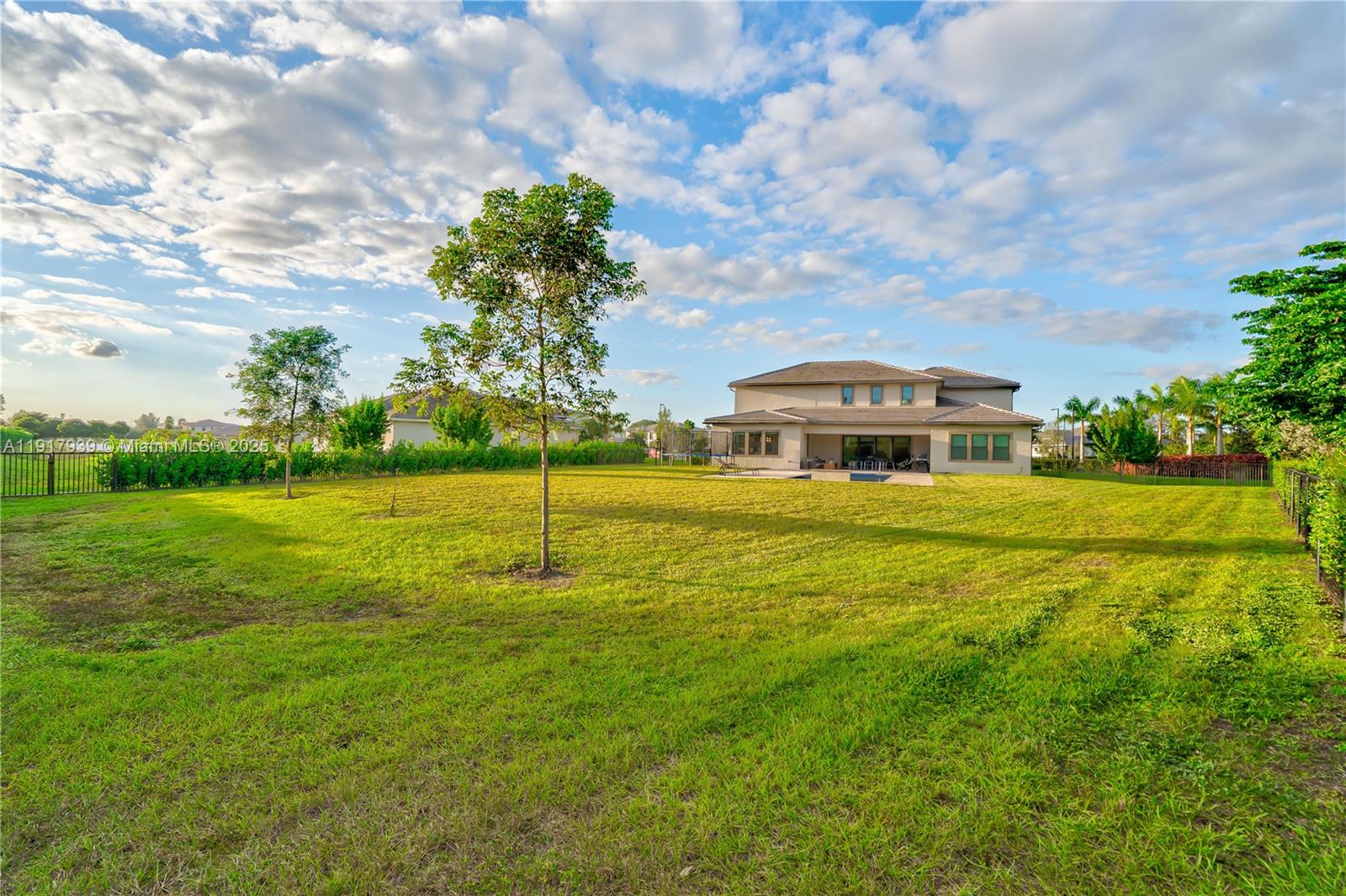14820 Millstone Ranches Drive Davie, FL 33331 - Photo 51 of 60 a front view of a house with a yard