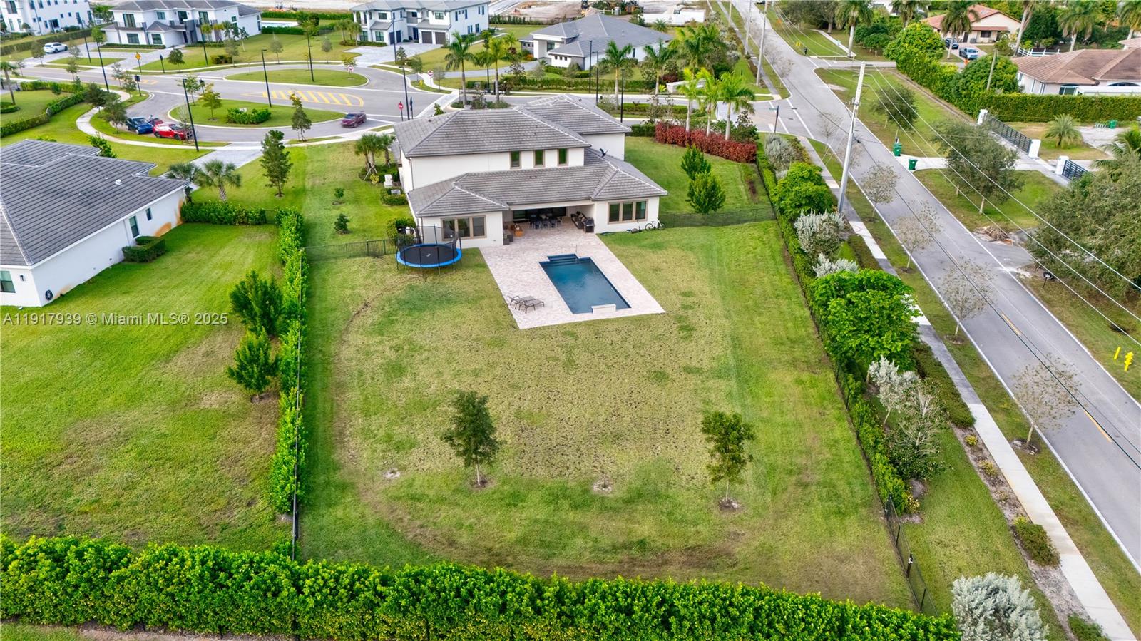 14820 Millstone Ranches Drive Davie, FL 33331 - Photo 54 of 60 an aerial view of residential houses with outdoor space