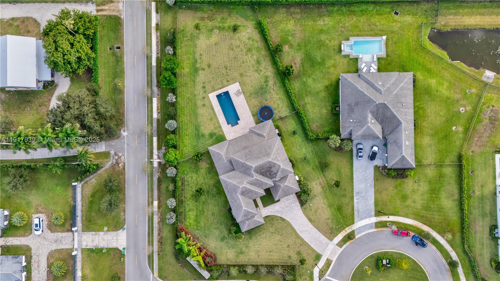 14820 Millstone Ranches Drive Davie, FL 33331 - Photo 56 of 60 an aerial view of a house with pool outdoor seating and yard